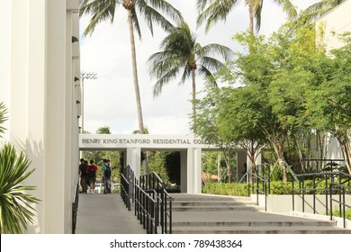 Coral Gables FL/USA: Nov 30, 2017 – Male College Students Wearing Backpacks Gather Outside Entrance To Henry King Stanford Residential College At University Of Miami. 
