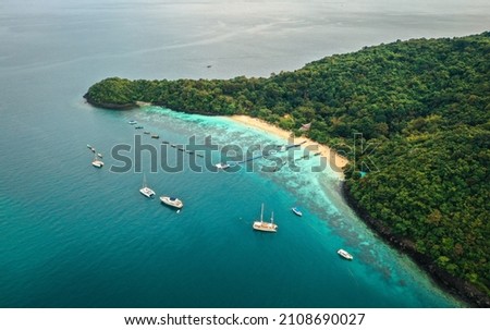 Coral island, koh He, beach and boats in Phuket province, Thailand