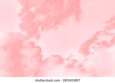 Coral pink soft color sky background with blurred clouds
