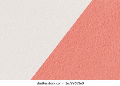Coral pink and white concrete wall texture background. Surface of stone texture in two tone background colors.