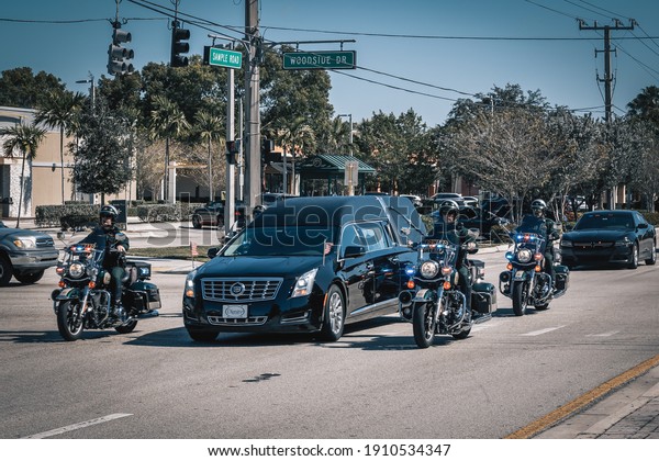Coral Springs, Florida, USA - February 05,\
2021:Funeral procession, cortege from a funeral home to the\
cemetery. Funeral Police\
cortege.