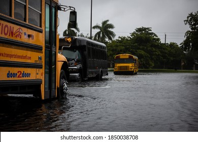 Coral Springs, Florida, USA - November 08, 2020: School Buses stuck in water during Hurricane Eta at Florida. Street Flood.