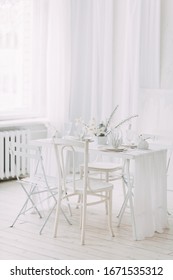  Coral And White Printing In Concept. Light Interior Of The Photo Studio. White Wedding Table Decor.