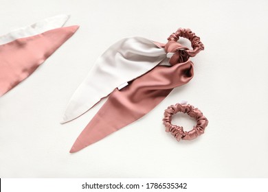 Coral-Pink hair accessories with textile rose. silk Pink Scrunchy isolated on white backdrop. Flat lay Hairdressing tools and accessories for woman - Colorful Hair Scrunchies, Elastic HairBands