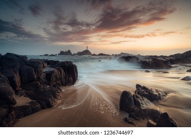 corbiere lighthouse at sunset in the Channel Islands
