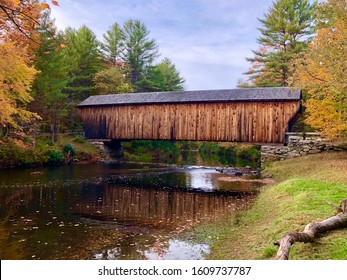 The Corbin Covered Bridge in Newport, New Hampshire on a sunny autumn day.