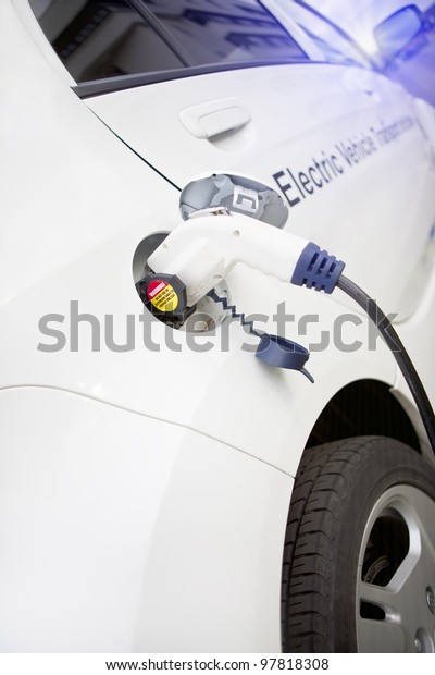 Cord hanging down from gas tank location on this\
electrical vehicle