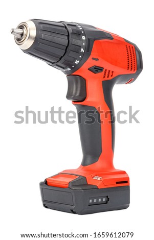 Cordless 12V drill driver powered by Li-ion battery with keyless chuck in red and black rubberized reinforced plastic case isolated on white background. Cut out construction tool image