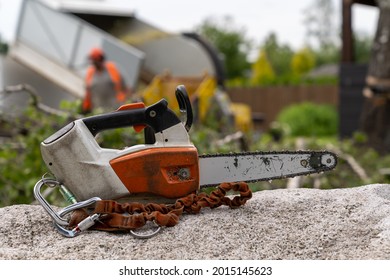 Cordless Arborist Top-hand Chainsaw

Arborist's Top-hand Chainsaw With Safety Strap Placed On The Chimney, Freshly Sawn Tree Branch Chopper With A Perceptible Human Floor Blurred In The Background