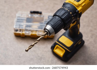 Cordless drill driver with a complete set of drill bits and screwdriver bits in a sturdy case. Versatile power tool for drilling and fastening