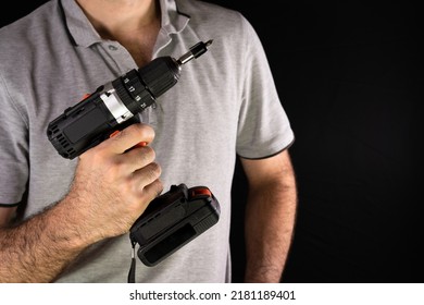 Cordless Drill Screwdriver In The Hands Of A Man