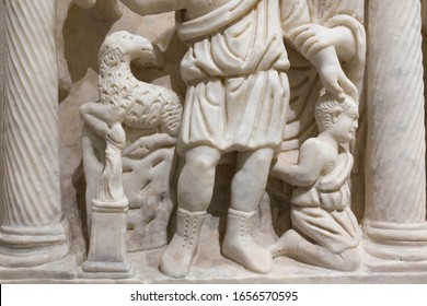 Cordoba, Spain - Dec 7th, 2018: Binding Of Isaac Scene At Gravestone Of Bishop Lampadius, 599 AC. Cordoba Archaelogical Museum