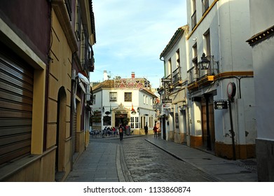 Cordoba, Spain - Feb 12, 2011: Picturesque street in the Jewish Quarter (Judería) near the Mosque - Cathedral in Córdoba, Andalusia, Spain - Shutterstock ID 1133860874