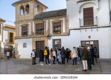 Cordoba, Spain - November 28 2021: Tourist Walking Tour Group In The Jewish Quarter Old Town Of Cordoba, Spain