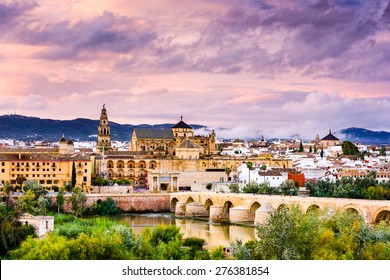 Cordoba, Spain at the Roman Bridge and Mosque-Cathedral on the Guadalquivir River.  - Shutterstock ID 276381854