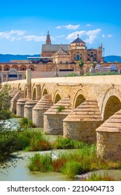 Cordoba, Spain. Roman Bridge on Guadalquivir river and The Great Mosque (Mezquita Cathedral) in the city of Cordoba, Andalusia. - Shutterstock ID 2210404713