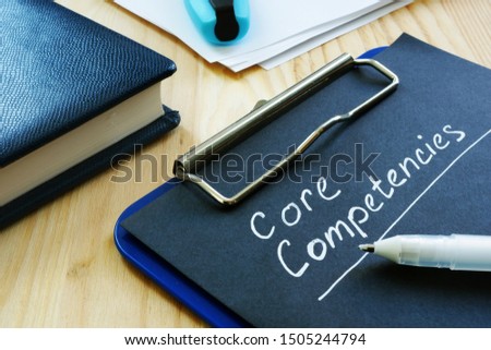 Core competencies list on the black page.