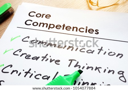 Core Competencies list on a office table.