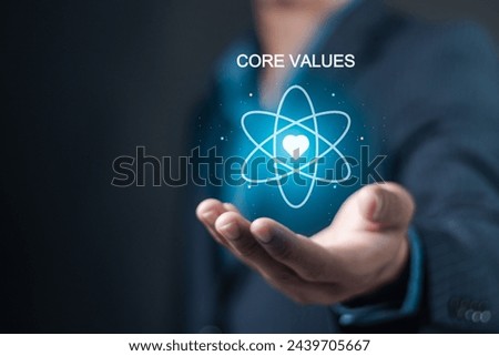 Core values responsibility ethics goals company concept. Businessman holding Core Values icon on virtual screen.