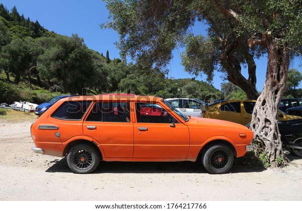 CORFU,\
GREECE - JUNE 2, 2016: Toyota Corolla youngtimer classic wagon car\
parked in Corfu Island, Greece. With 566 registered vehicles per\
1000 inhabitants Greece is below EU average\
(573).