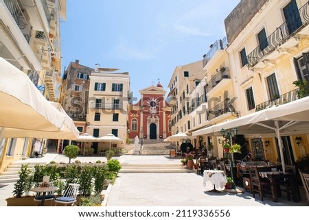 Corfu town picturesque street with cafe and flowers, Corfu island, Greece