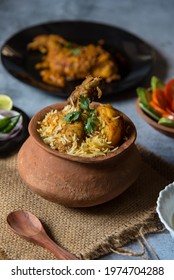 Coriander Leaf On Mughlai Cuisine Biryani With Use Of Selective Focus On A Particular Part Of The Leaf With Rest Of The Leaf, The Biryani And Everything Else Blurred.