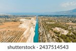 Corinth Canal, Greece. The Corinth Canal is a sluiceless shipping canal in Greece, connecting the Saronic Gulf of the Aegean and the Gulf of Corinth of the Ionian Sea, Aerial View  