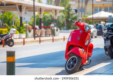Corinth. Greece - Aug. 20 2020: red Vespa scooter on Corinth street