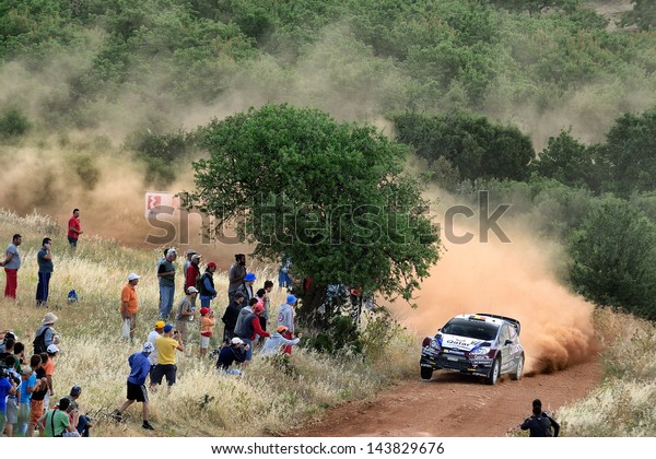 CORINTHIA, GREECE - JUN 1: Belgian driver Thierry\
Neuville and his codriver Nicolas Gilsoul in a Ford Fiesta RS WRC\
race in the 59th Acropolis Rally of Greece, on Jun 1, 2013 in\
Loutraki, Greece.