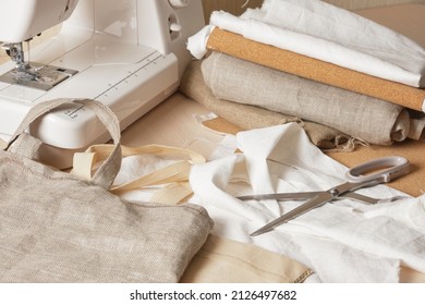 cork bag sewing process, natural materials for eco-friendly accessories, cotton and cork leather shopper, leggings and a sewing machine on blanks for tailoring - Powered by Shutterstock