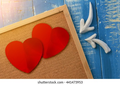 Cork Board With Arrow And Red Heart With Wooden Background Love Concept