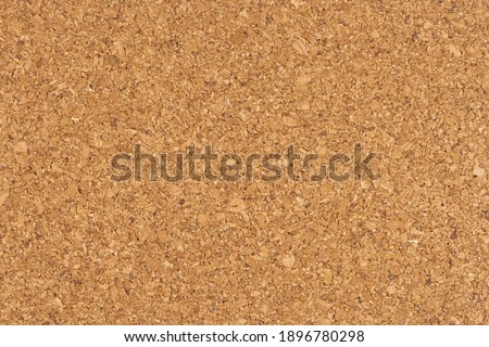 Cork board background texture - insert your own message or bulletin with thumbtacks. Top view.