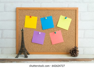 Cork Board And Colorful Blank Paper Notes With Eiffel Tower Model - Travel Plan Concept