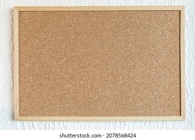 Cork board or corkboard at white  painted wall background