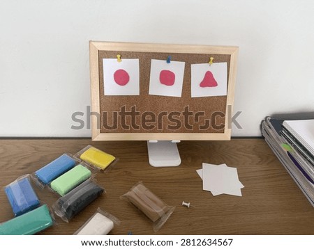 a cork board and creative objects