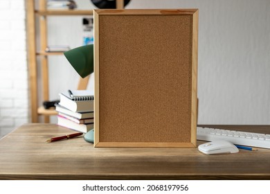 Cork board frame background at table in office. Student home workplace