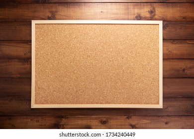 cork board on wooden background texture