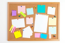 Cork Board With Several Colorful Blank Notes With Pins