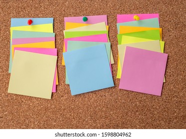 Cork board with several colorful blank notes with pins - Shutterstock ID 1598804962