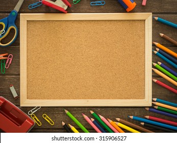 Cork Board And Stationery Put On Desk Free Space For Text . View From Above. Educations Concept, Back To School Concept.