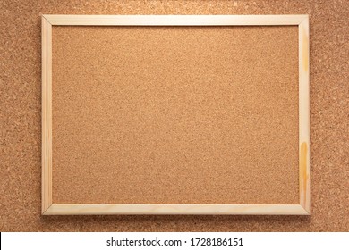 cork board in wooden frame as background texture