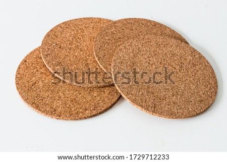 Cork coaster with white background. Top view.