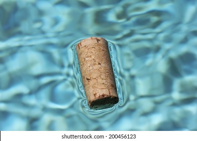 Cork Floating in Blue Water