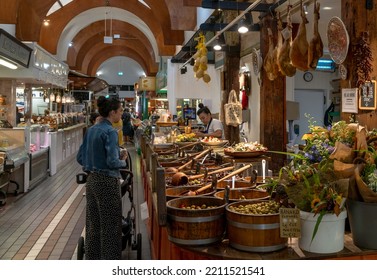 Cork, Ireland - 16 August, 2022: Customers Buying Food At A Market Stall With Spanish Delicacies And Iberico Hams