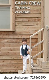 CORK, IRELAND - July, 20th, 2012: Little Girl In A Front Of Cabin Crew Training Academy In A Cork Airport 