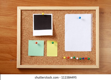 Cork Message Board With Various Paper Notes