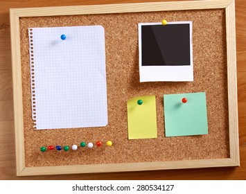 Cork Message Board With Various Paper Notes