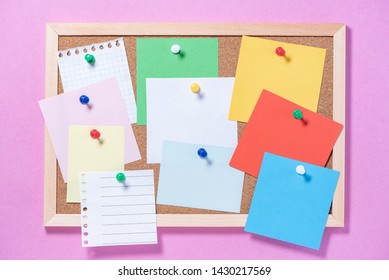 Corkboard For Notes With Empty Paper Sheets On Buttons On A Pink Background