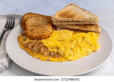 corn beef hash omelette served with hash browns and toast