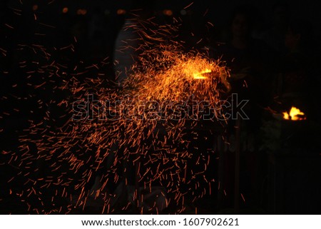 Corn being cooked on coal near beach with some fire spark . A corn roaster sparkling fire in the shores of Marina Beach, Chennai, India on night
